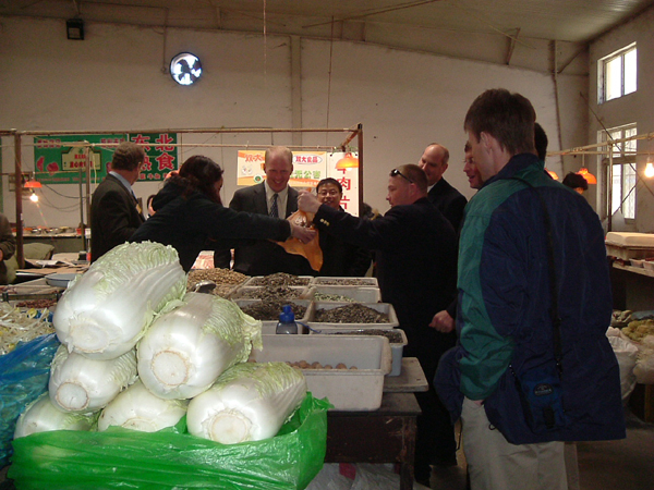 guests stop at local farmers's market